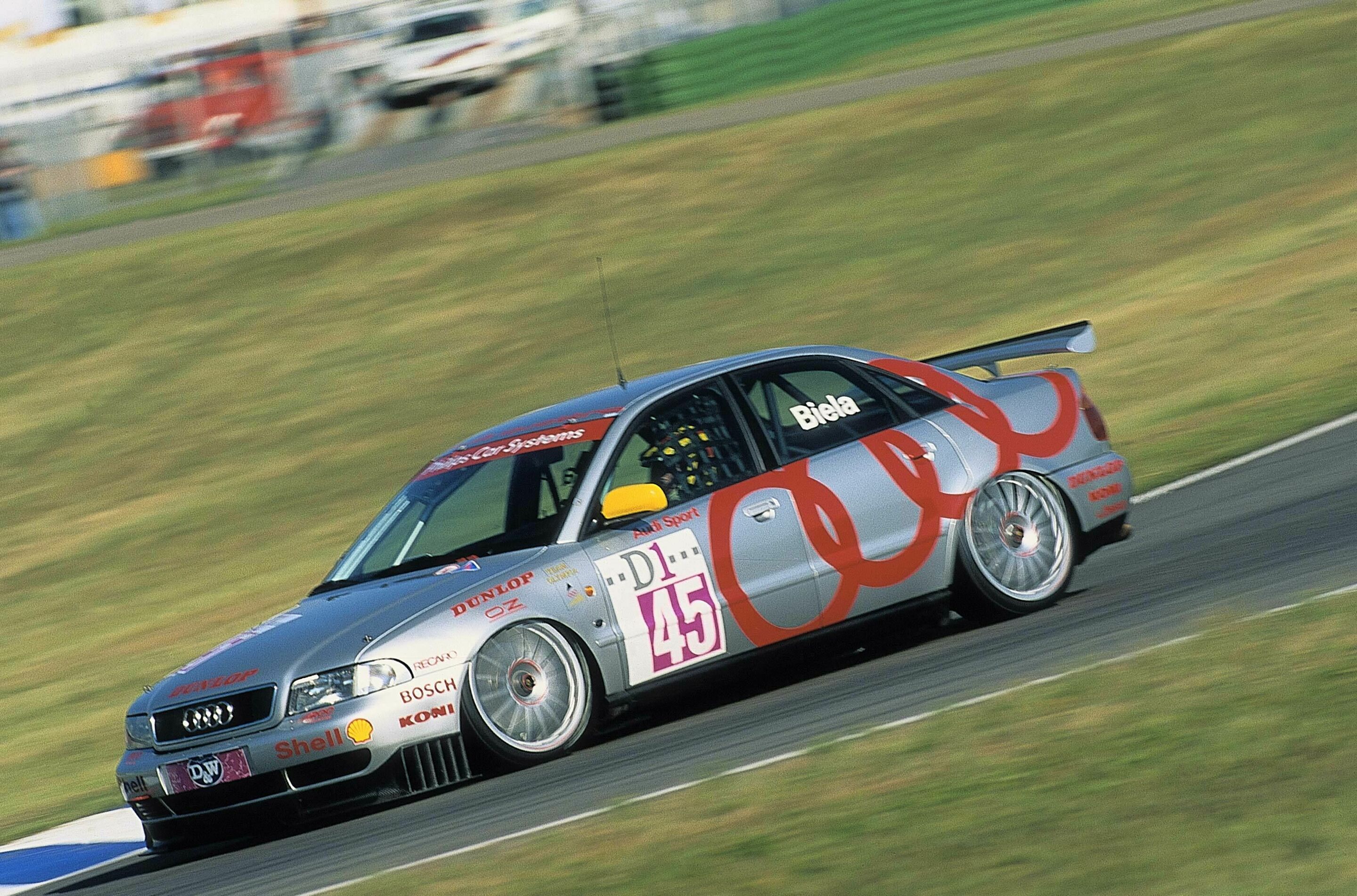 Audi Motorsport History - 1995: Frank Biela wins the Touring Car World Cup with the Audi A4 quattro (pictured racing in Germany)